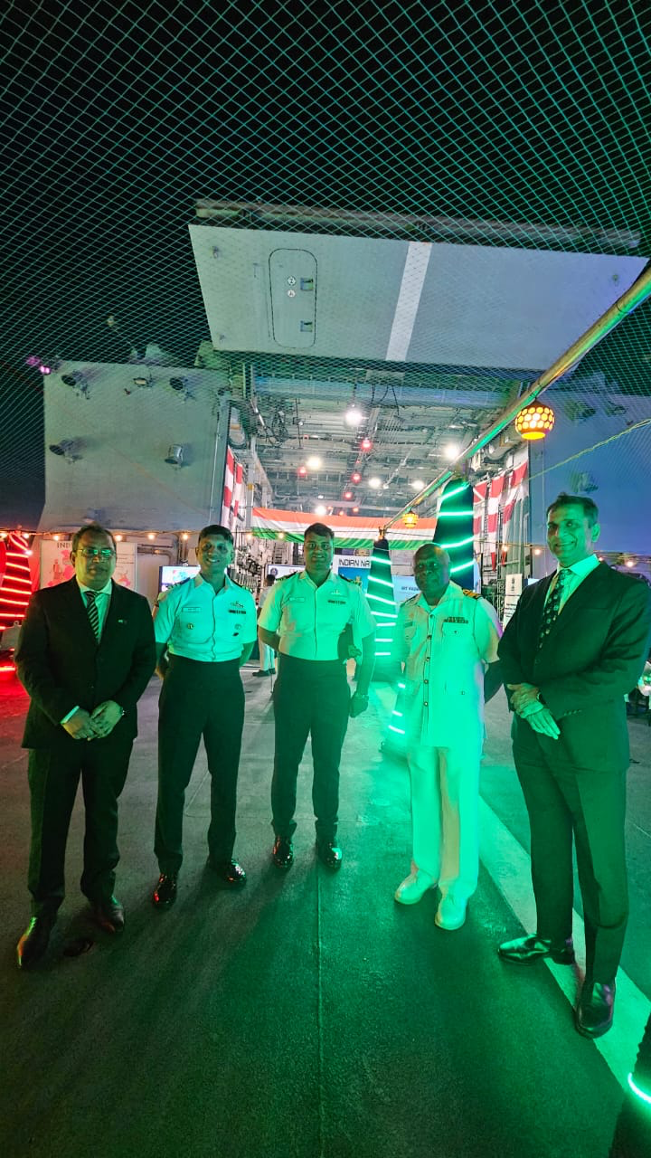 Guests and officers on the flight deck of INS Kadmatt during the commemorative function